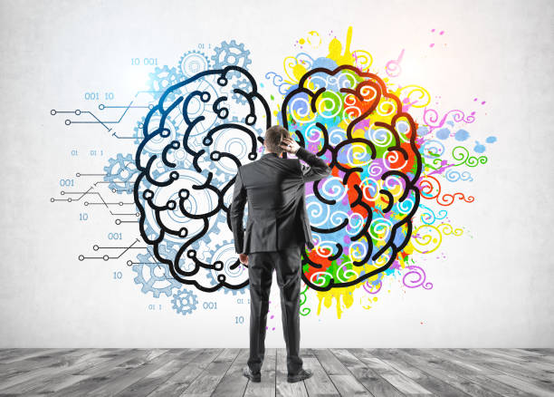 istock Confused man looking at left and right brain 1203575779