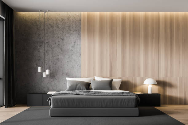 istock Concrete and wooden master bedroom interior 1203578746