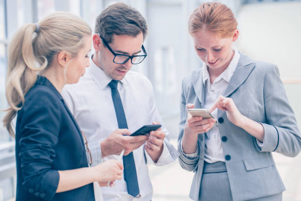 istock Business people with mobile phones 1203578885