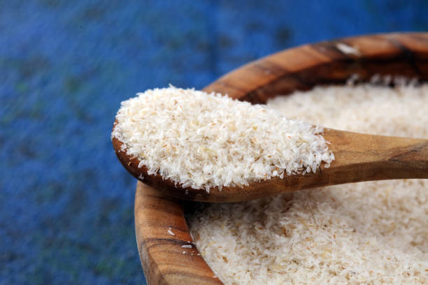 istock Portion of Psyllium Seeds on rustic dark background. Psyllium seed husks on wood 1203579336