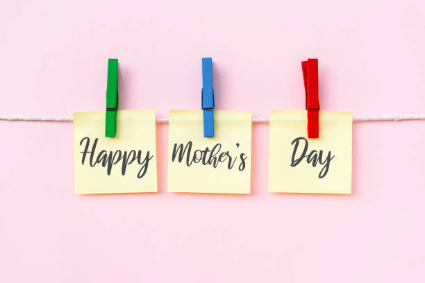 istock Happy Mother's Day greeting text on hanging paper note 1203579509