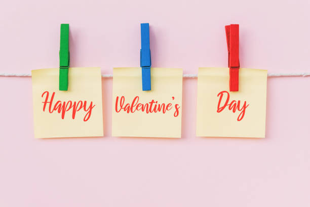 istock Happy Valentine's Day text on hanging paper note 1203579538