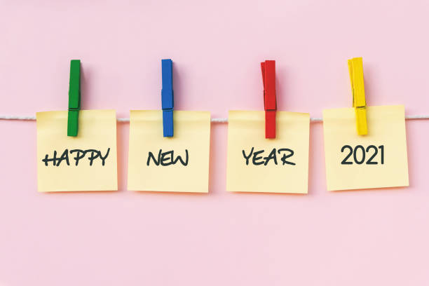 istock Happy New year 2021 greeting on hanging paper note 1203579614