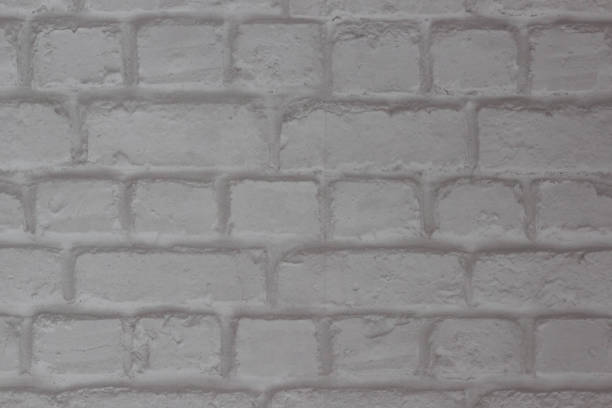 istock Abstract background of white brick in the masonry close-up 1203580130