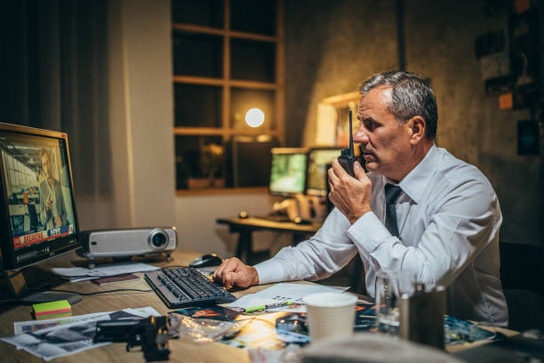 istock Detective with walkie-talkie 1203580131