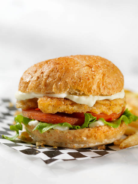 istock Vegan, Meatless-Plant Based Protein Chicken Strip Burger on a Whole Wheat Bun with Lettuce Tomato 1203580304