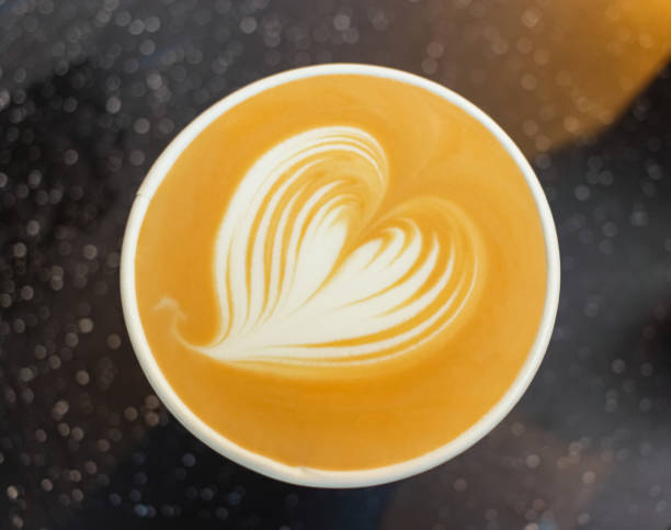 istock Latte art of latte coffee.  Heart-shaped pull flower art 1203582013