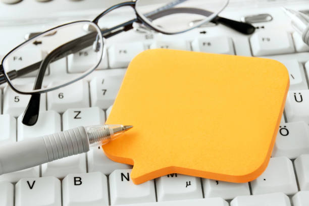 istock Business background with paper and pen 1203582704