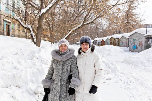 istock Two mature walking women 1203583157