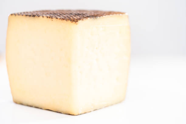 istock Large slice of aged Manchego cheese on a white background. 1203585191