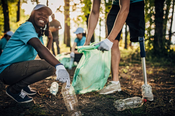 istock Volunteers cleaning garbage in park 1203586623