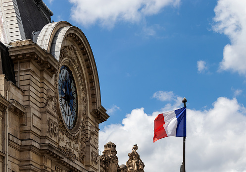 The famous Musée d'Orsay in Paris together with the french flag