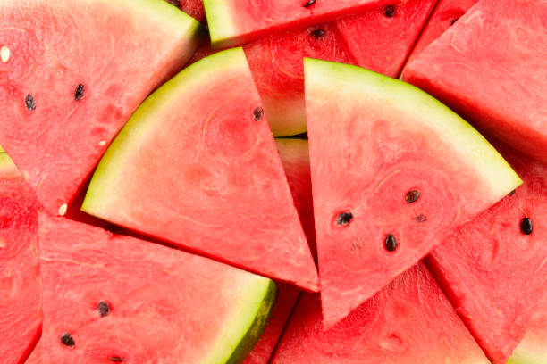 istock Juicy watermelon slices background. Top view. 1203587572