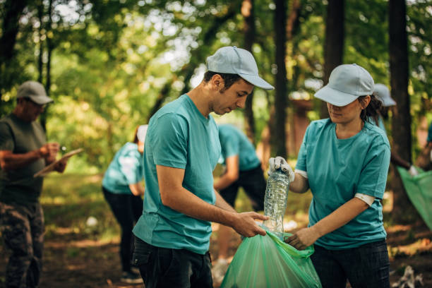 istock Volunteers cleaning garbage in park 1203588778