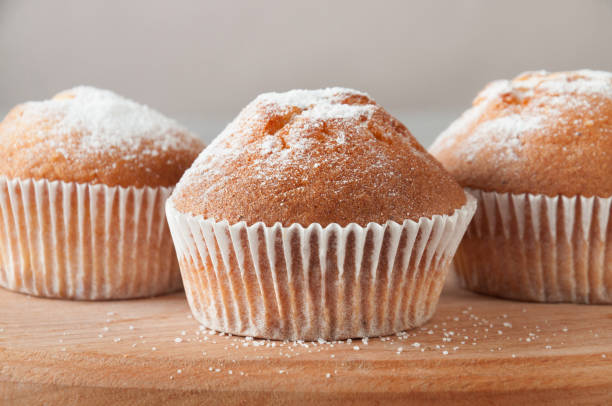 istock Tasty muffin closeup on a wooden board, selective focus. 1203590955