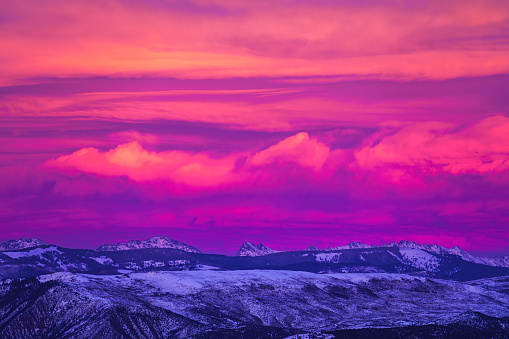 Gore Range Mountains Sunset - Winter landscape scenic with vibrant sunset sky and clouds.