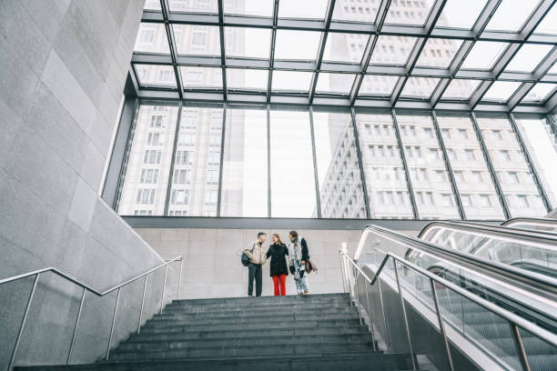 istock three young people in modern berlin subway station 1203592289