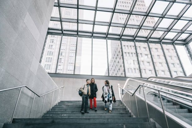 istock three young people in modern berlin subway station 1203592363