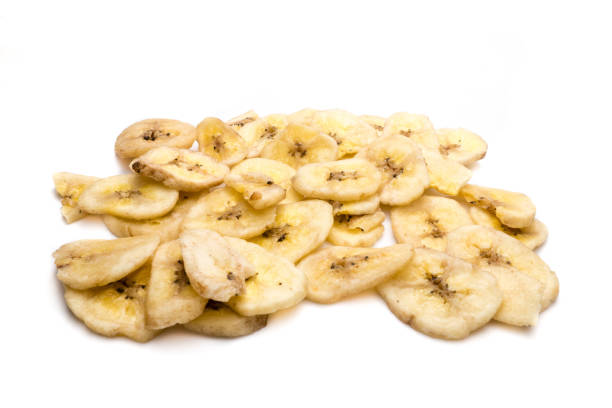 istock dried banana chips isolated on white background 1203592589