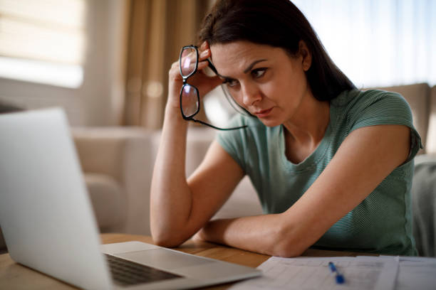 istock Woman struggling with new technology 1203592692