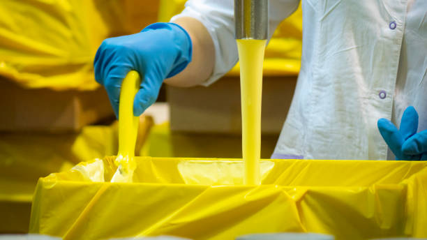 istock Production of butter. Dairy-based cream products 1203594050
