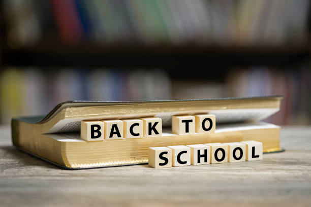 istock Book on desk with Back to school text 1203595076