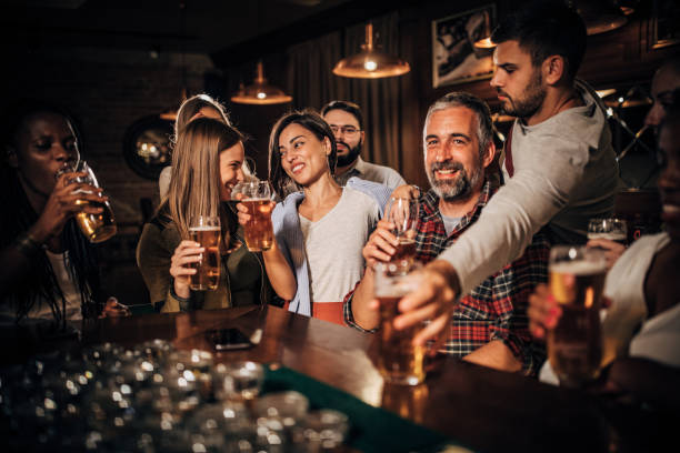istock Happy friends in bar 1203595386