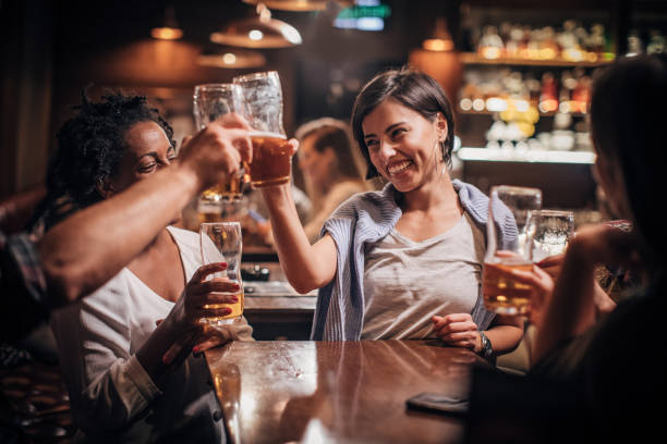 istock Happy friends in bar 1203595433