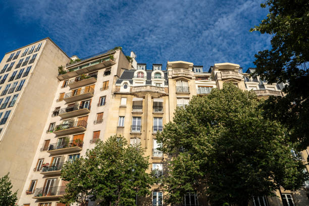 istock Parisian architecture high rise complex with apartments and balconies on sunny day 1203596615