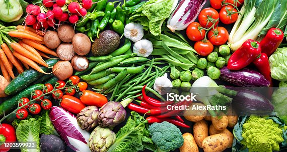istock Food background with assortment of fresh organic vegetables 1203599923