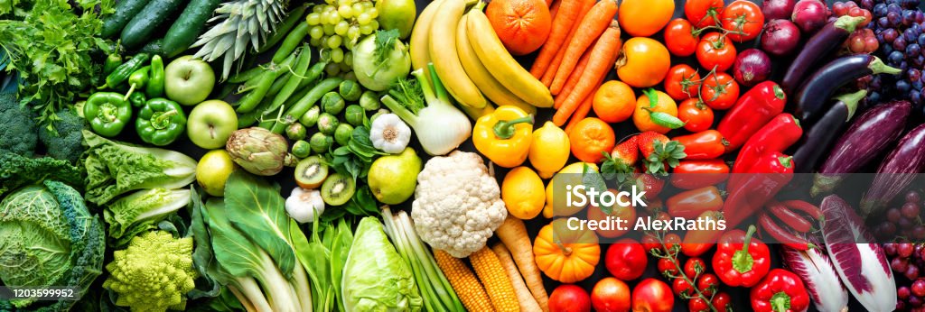 Assortment of fresh organic fruits and vegetables in rainbow colors Panoramic food background with assortment of fresh organic fruits and vegetables in rainbow colors Vegetable Stock Photo