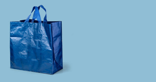 istock blue shopping bag isolated on white background 1203600557