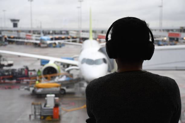 Female dispatcher helping to navigate airplane in the sky