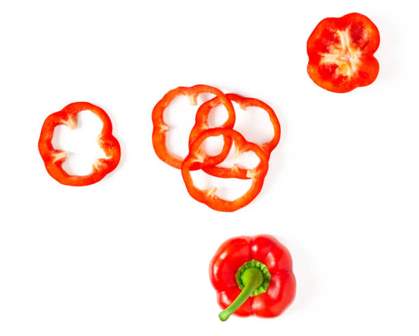 istock Red sliced bell pepper isolated on white background top view. 1203601889