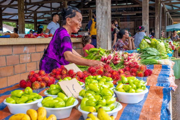 Hmong ethnic woman on a farmer market, Cacao, French Guiana stock photo