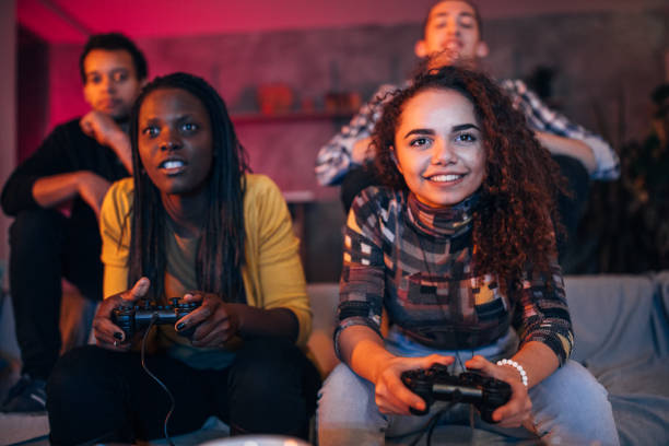 istock Young friends playing video games 1203604649