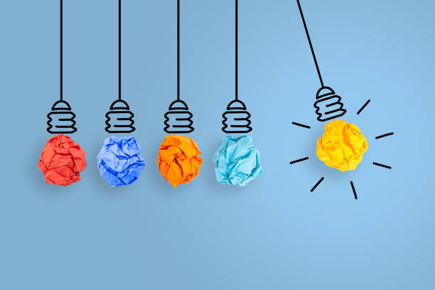 istock Creative Idea Concepts with Light Bulb Crumpled Paper on Blue Background 1203604689