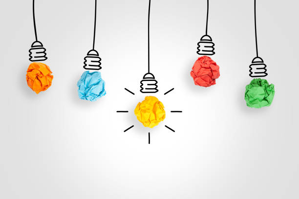 istock Idea Concepts with Light Bulb Crumpled Paper on White Background 1203604692
