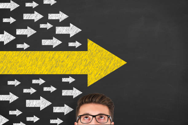 istock Leadership Concepts with Arrows on Chalkboard Background 1203607036