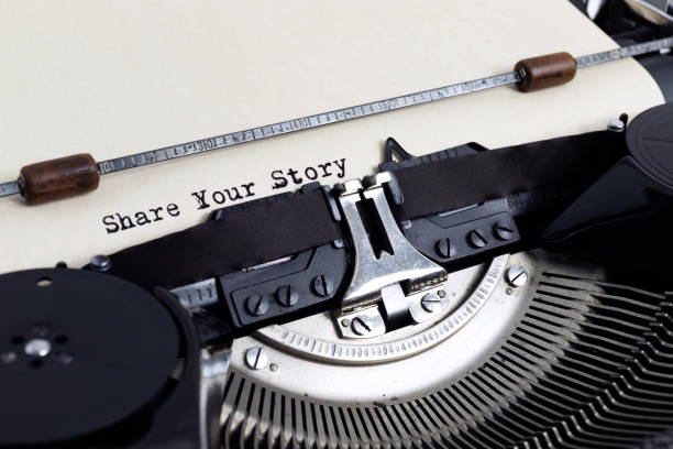 istock Heading Share Your Story written with typewriter on yellowish paper 1203608052