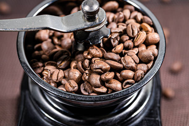 istock The fried coffee beans lie in a coffee grinder. Arab coffee is prayed in a mechanical coffee grinder. Morning coffee. 1203609322