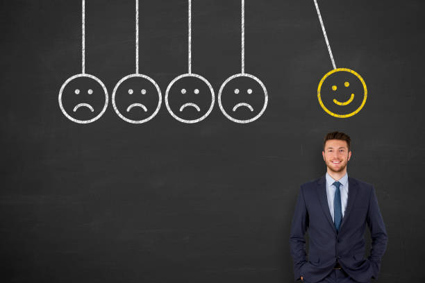istock Hand Drawing Unhappy and Happy on Blackboard 1203610293