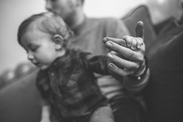 istock Happy father with his son playing at home on the bed 1203610781