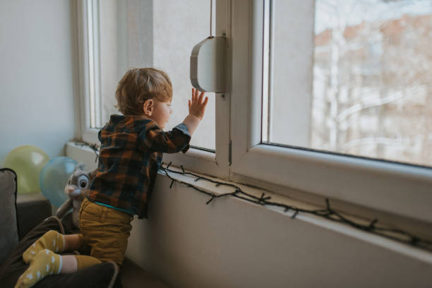 istock Caucasian baby boy plays at home 1203610999