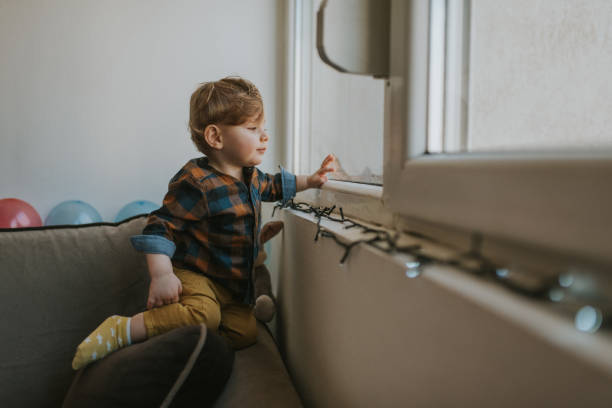 istock Caucasian baby boy plays at home 1203611005