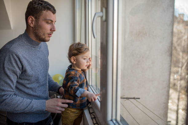 istock Happy father with his son playing at home on the bed 1203611011