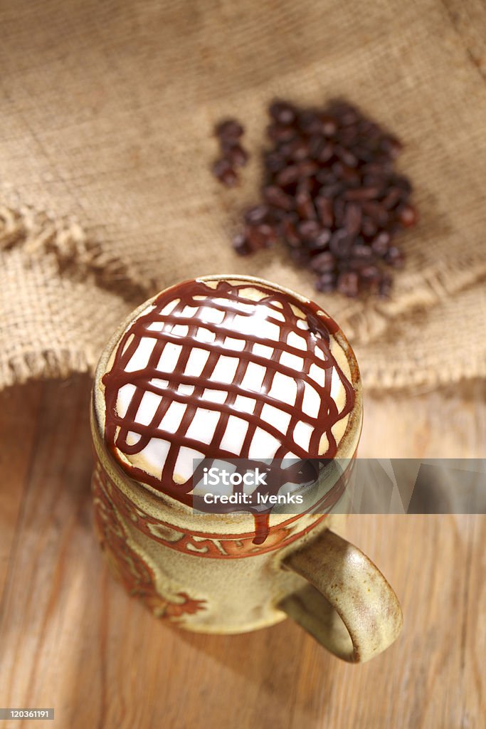 hot frothy  coffee cappuccino chocolate topping, in rustic style hot frothy  coffee cappuccino chocolate topping, in rustic style, shallow dof Backgrounds Stock Photo