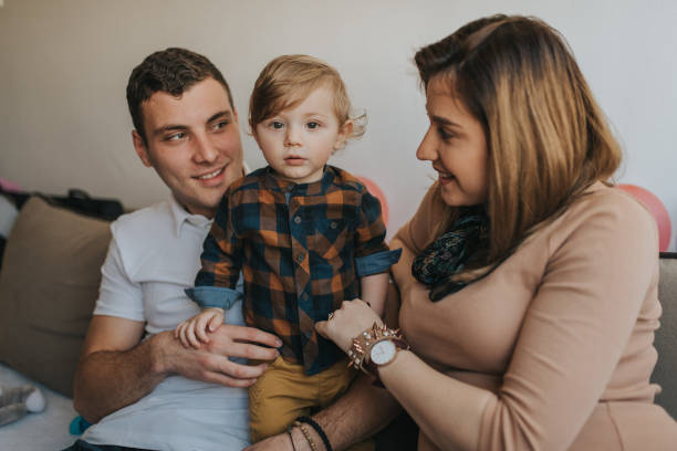 istock Family with one child is having fun together. 1203612024