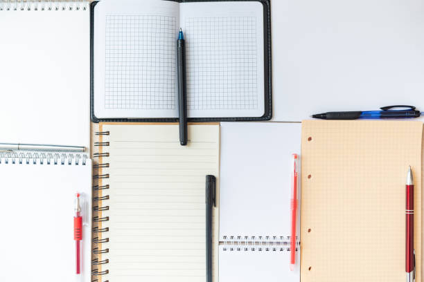 istock Textured background from blank open notebooks, notes and albums 1203613467