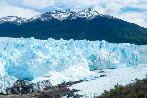 istock The Perito Moreno glacier with snowy mountain summits in the background 1203613667